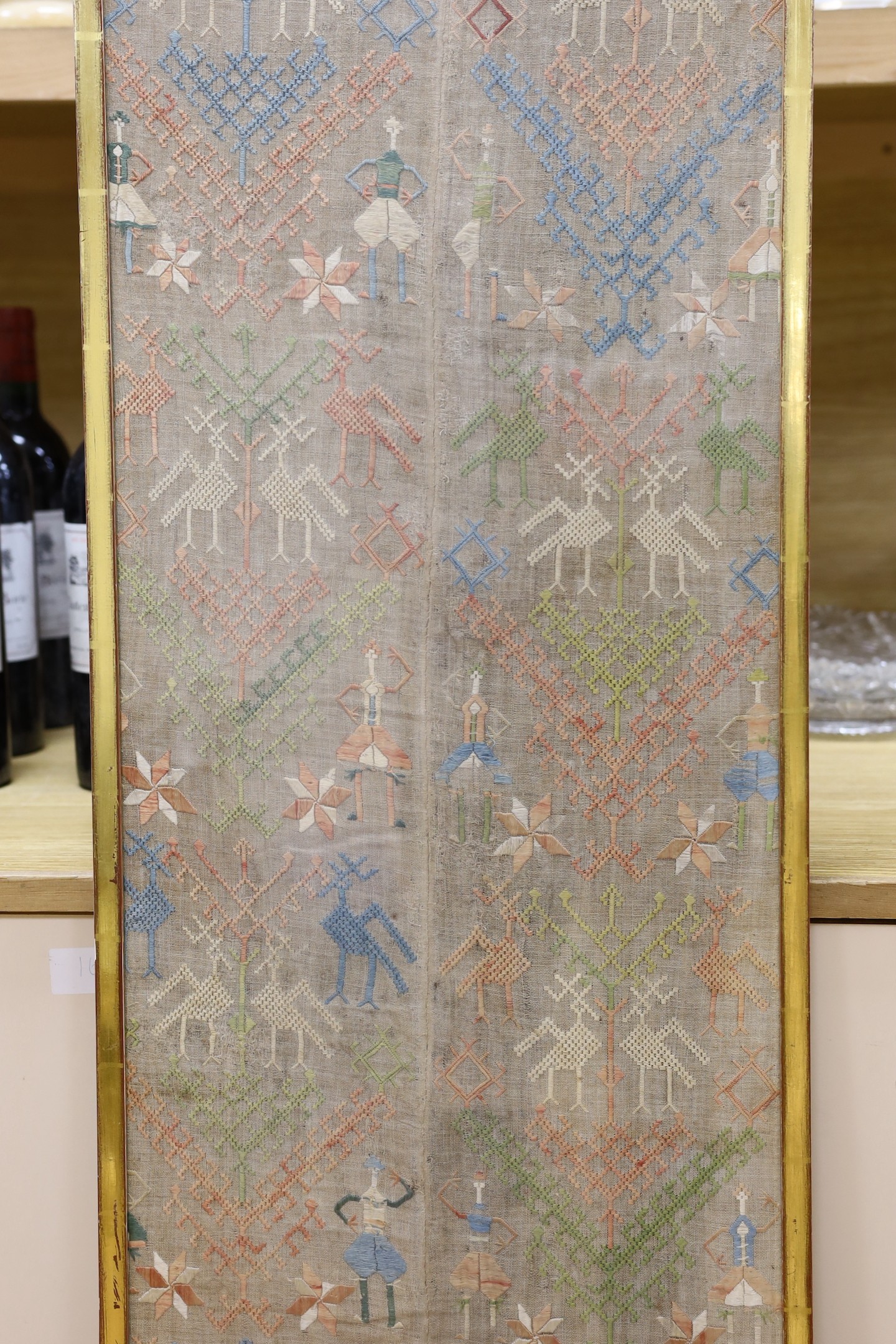 Two framed Greek needlework panels, largest 146x33cm excl frame